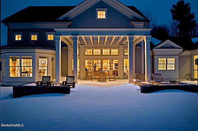 258 Sandisfield Rd, New Marlborough, MA 01230 - snow covered house with a standing seam roof and a patio