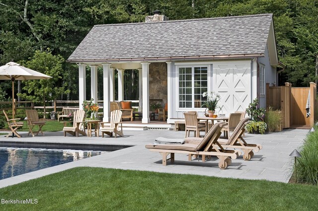 258 Sandisfield Rd, New Marlborough, MA 01230 - view of patio / terrace featuring an outdoor structure, an exterior structure, and an outdoor pool