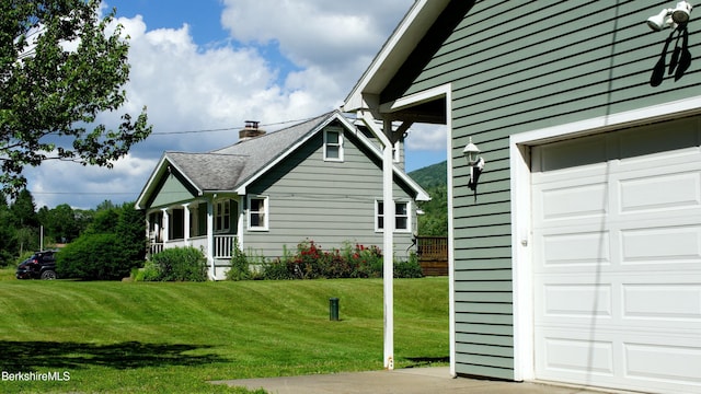 366 Clough Rd, Stamford, VT 05352 - view of side of home featuring a garage and a yard
