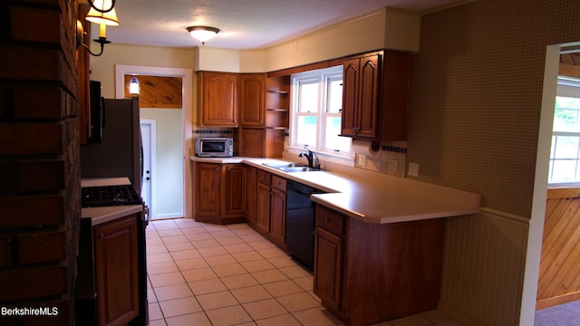 366 Clough Rd, Stamford, VT 05352 - kitchen with gas range oven, open shelves, a sink, light countertops, and a peninsula