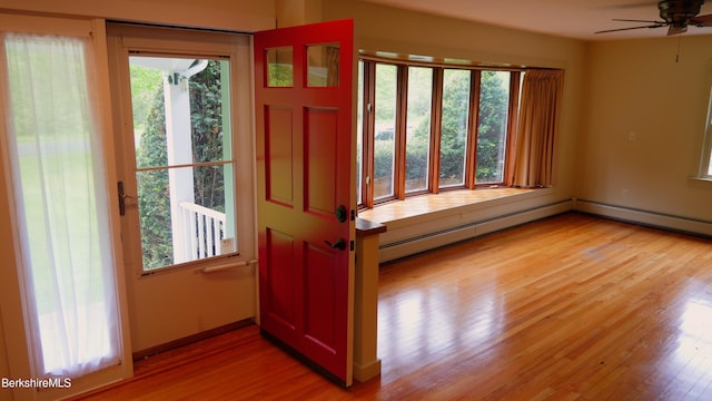 366 Clough Rd, Stamford, VT 05352 - entryway with light wood-type flooring, healthy amount of natural light, ceiling fan, and a baseboard radiator