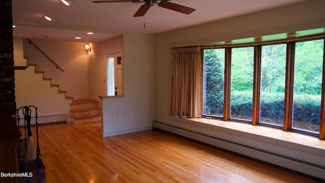 366 Clough Rd, Stamford, VT 05352 - unfurnished living room with a baseboard radiator, healthy amount of natural light, and recessed lighting