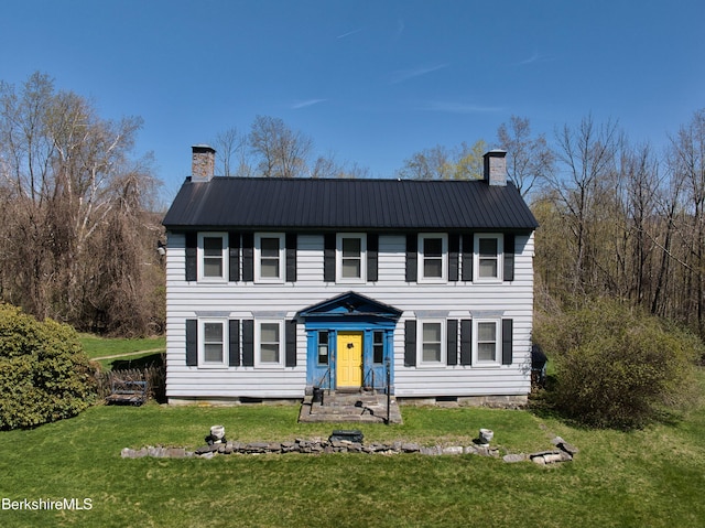 332 W Rd, Adams, MA 01220 - view of front of home with a chimney, metal roof, and a front lawn