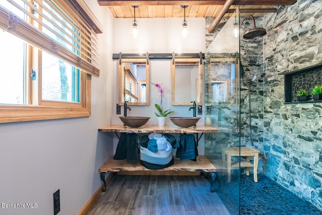 78 Slope Rd, Tolland, MA 01034 - bathroom featuring wooden ceiling with exposed beams, healthy amount of natural light, a walk in shower, wood finished floors, and double vanity