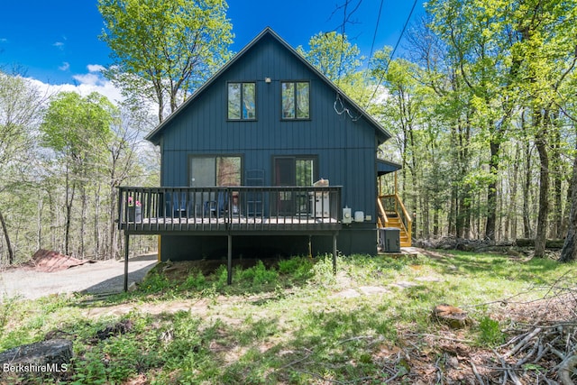 78 Slope Rd, Tolland, MA 01034 - rear view of property with a wooden deck and cooling unit