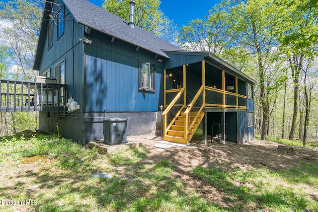 78 Slope Rd, Tolland, MA 01034 - rear view of property featuring a shingled roof