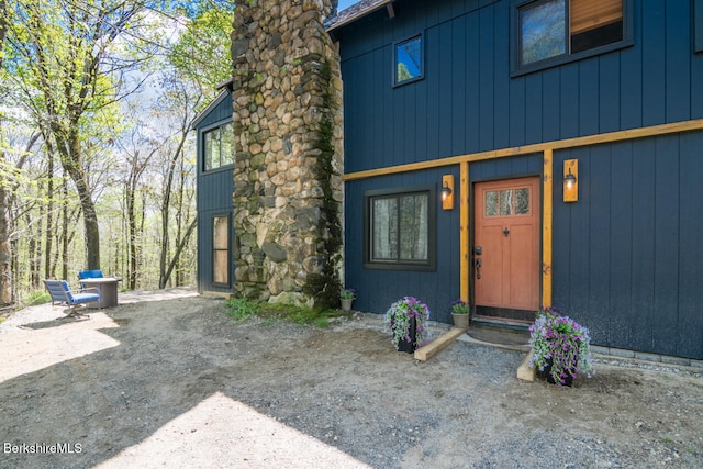 78 Slope Rd, Tolland, MA 01034 - property entrance with a chimney
