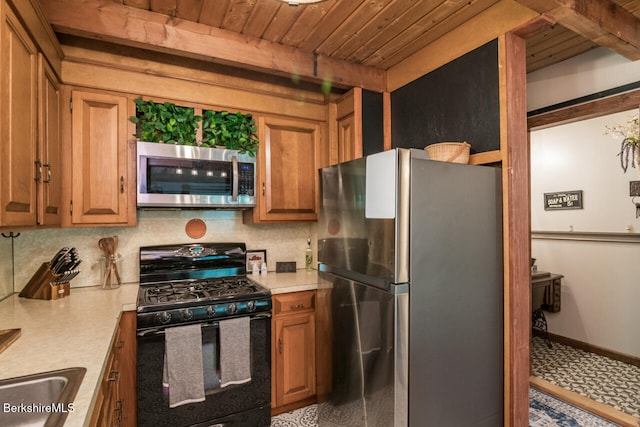 78 Slope Rd, Tolland, MA 01034 - kitchen with stainless steel appliances, wood ceiling, light countertops, decorative backsplash, and brown cabinetry