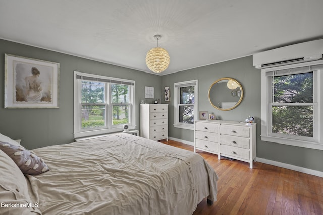 7 Chicopee St, Lanesborough, MA 01237 - bedroom featuring a wall mounted air conditioner and wood finished floors