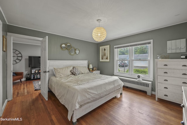 7 Chicopee St, Lanesborough, MA 01237 - bedroom featuring radiator heating unit and wood finished floors