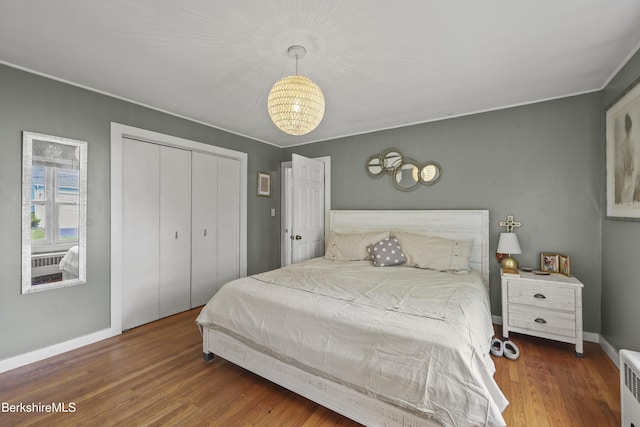 7 Chicopee St, Lanesborough, MA 01237 - bedroom with a chandelier, wood finished floors, a closet, and crown molding