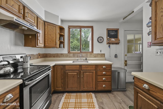 7 Chicopee St, Lanesborough, MA 01237 - kitchen with stainless steel electric range oven, under cabinet range hood, and light countertops