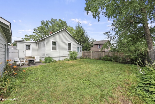 7 Chicopee St, Lanesborough, MA 01237 - fenced backyard featuring a fire pit and a patio area