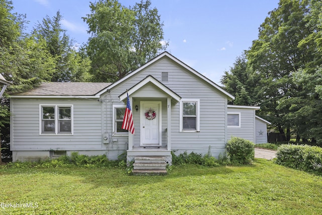 7 Chicopee St, Lanesborough, MA 01237 - bungalow featuring a front yard and roof with shingles