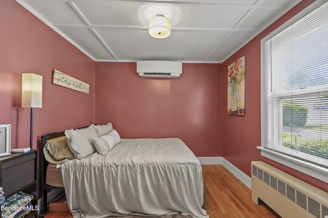 7 Chicopee St, Lanesborough, MA 01237 - bedroom with radiator, a wall mounted air conditioner, and wood finished floors