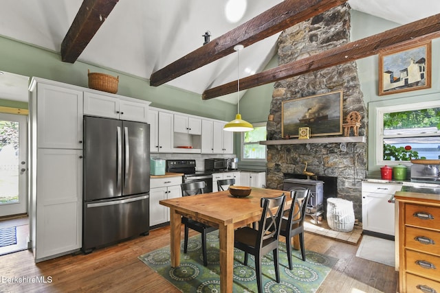 20 E Dugway Rd, Lenox, MA 01240 - kitchen with black appliances, white cabinets, plenty of natural light, dark wood-style floors, and beam ceiling