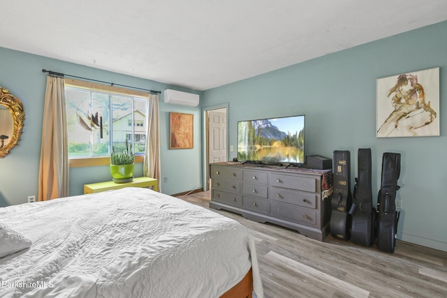 20 E Dugway Rd, Lenox, MA 01240 - bedroom with a wall mounted air conditioner and wood finished floors
