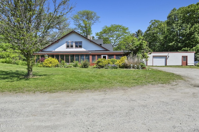 20 E Dugway Rd, Lenox, MA 01240 - farmhouse-style home with dirt driveway, an attached garage, and a front lawn