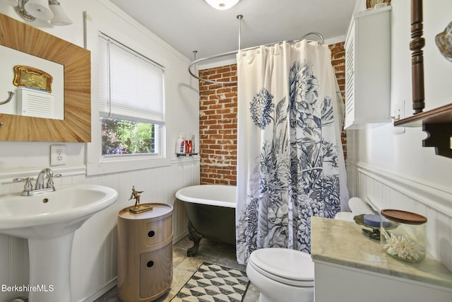20 E Dugway Rd, Lenox, MA 01240 - bathroom featuring a wainscoted wall, a soaking tub, brick wall, and curtained shower