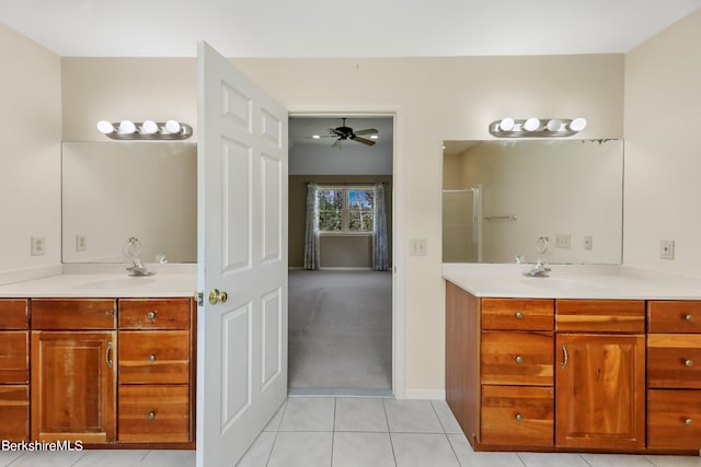 bathroom with two vanities, a sink, and ceiling fan