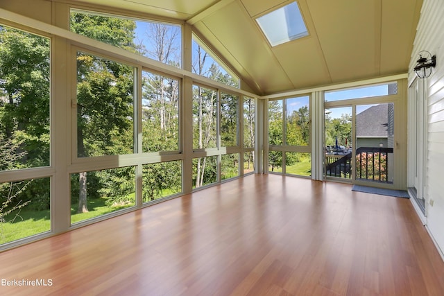 unfurnished sunroom with lofted ceiling