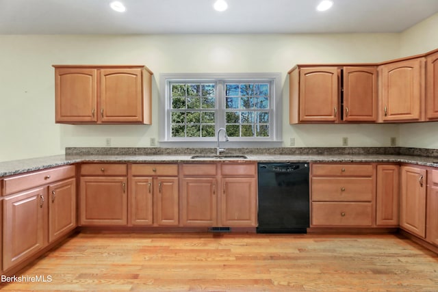 kitchen featuring a sink, light wood-type flooring, dishwasher, and recessed lighting