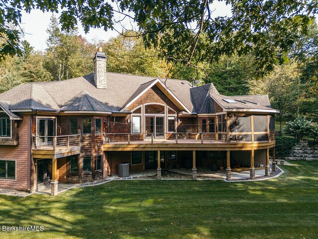 116 Brush Hill Rd, Great Barrington, MA 01230 - back of house featuring a lawn, a deck, central AC unit, a chimney, and a shingled roof