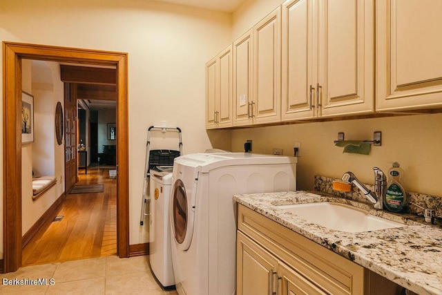 116 Brush Hill Rd, Great Barrington, MA 01230 - clothes washing area featuring cabinet space, separate washer and dryer, and light tile patterned floors