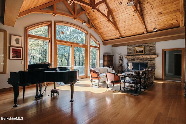 116 Brush Hill Rd, Great Barrington, MA 01230 - sitting room featuring wood ceiling, beamed ceiling, wood-type flooring, high vaulted ceiling, and a stone fireplace