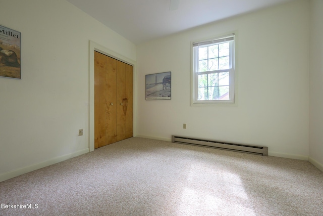 33 Interlaken Rd, Stockbridge, MA 01262 - unfurnished bedroom featuring a baseboard radiator, carpet, and a closet