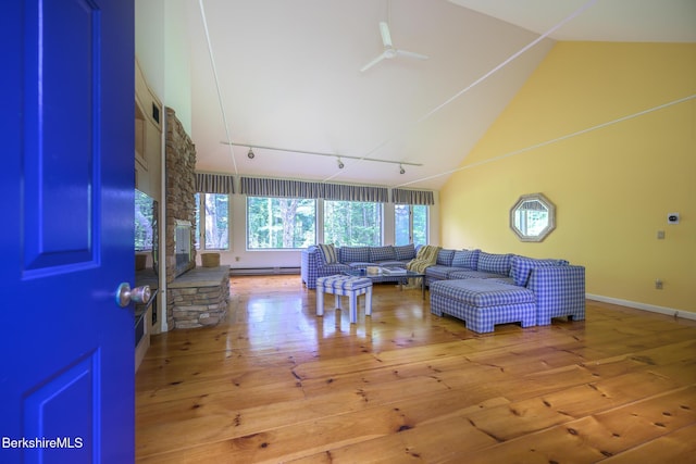 33 Interlaken Rd, Stockbridge, MA 01262 - living room with hardwood / wood-style floors, high vaulted ceiling, a baseboard heating unit, and ceiling fan