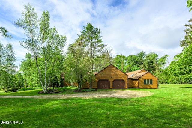 33 Interlaken Rd, Stockbridge, MA 01262 - view of front facade featuring a garage, dirt driveway, and a front yard