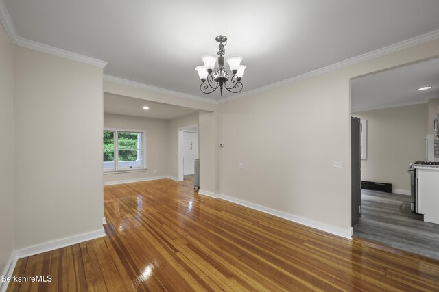 32 Hampshire St, Pittsfield, MA 01201 - spare room featuring wood-type flooring, a chandelier, crown molding, and recessed lighting