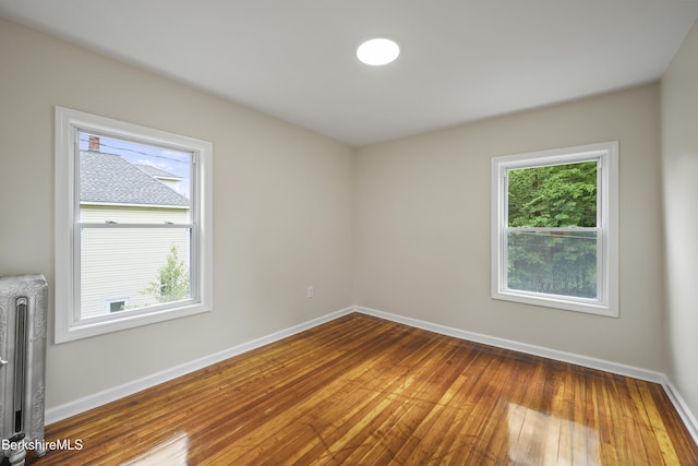 32 Hampshire St, Pittsfield, MA 01201 - spare room with radiator heating unit and hardwood / wood-style flooring