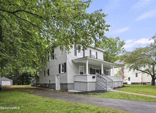 32 Hampshire St, Pittsfield, MA 01201 - traditional style home with covered porch, a front yard, and an outdoor structure
