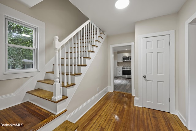 32 Hampshire St, Pittsfield, MA 01201 - staircase with hardwood / wood-style floors and baseboards
