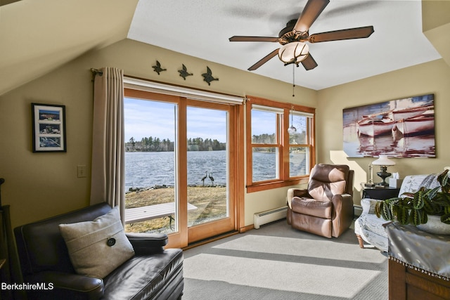 living area featuring vaulted ceiling, carpet flooring, a baseboard radiator, a water view, and ceiling fan