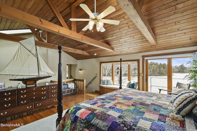 bedroom with access to exterior, lofted ceiling with beams, wood finished floors, and wood ceiling