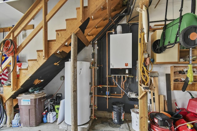 utility room featuring tankless water heater and gas water heater