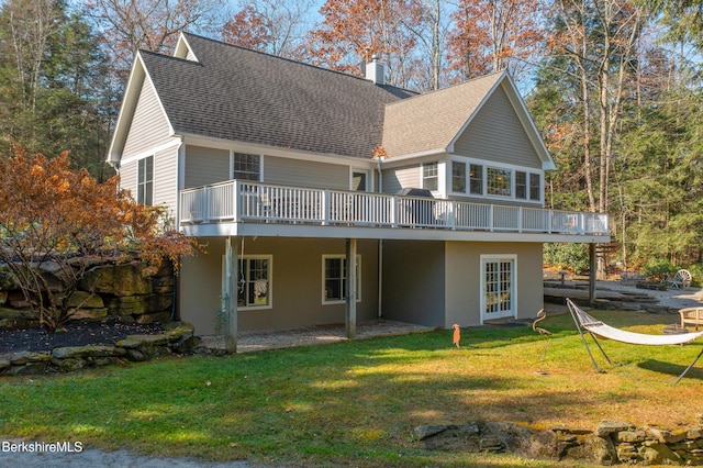 2017 Monterey Rd, Otis, MA 01253 - rear view of property with a wooden deck, a chimney, a shingled roof, and a yard