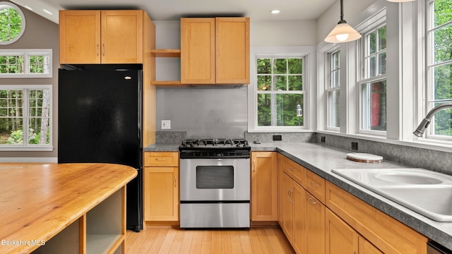 2017 Monterey Rd, Otis, MA 01253 - kitchen with stainless steel range with gas cooktop, black fridge, open shelves, light wood-style floors, and recessed lighting