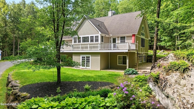 2017 Monterey Rd, Otis, MA 01253 - rear view of house with a wooden deck, a lawn, a chimney, french doors, and stucco siding