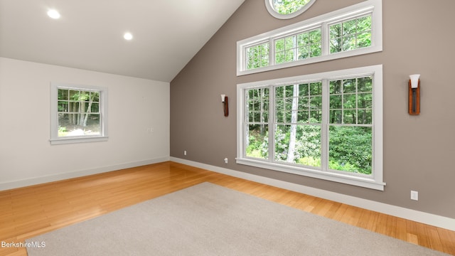 2017 Monterey Rd, Otis, MA 01253 - spare room with wood finished floors, high vaulted ceiling, and recessed lighting