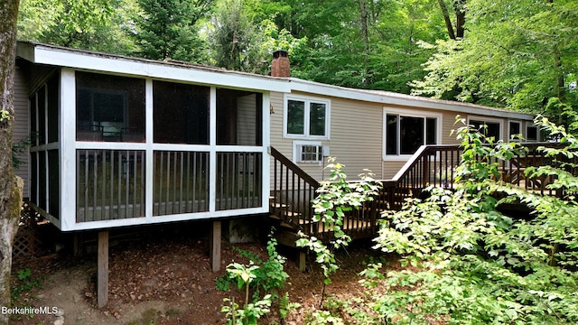 51 Downs Rd, New Marlborough, MA 01230 - back of property with a sunroom, a chimney, and a deck