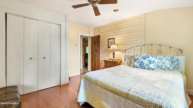 51 Downs Rd, New Marlborough, MA 01230 - bedroom featuring hardwood / wood-style flooring, a closet, a ceiling fan, and wooden walls