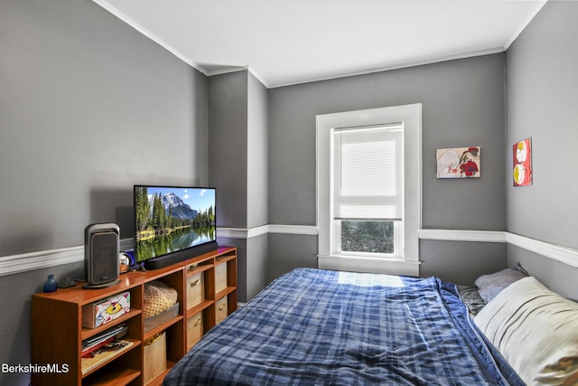 bedroom with crown molding