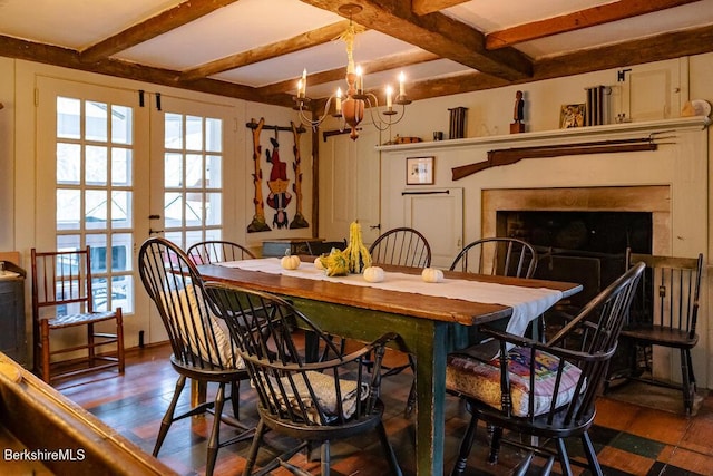 dining room featuring beamed ceiling, a chandelier, and dark hardwood / wood-style floors