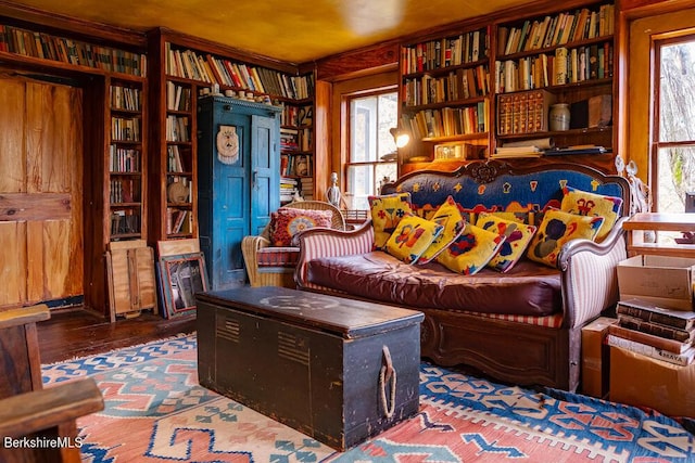 living area with hardwood / wood-style floors