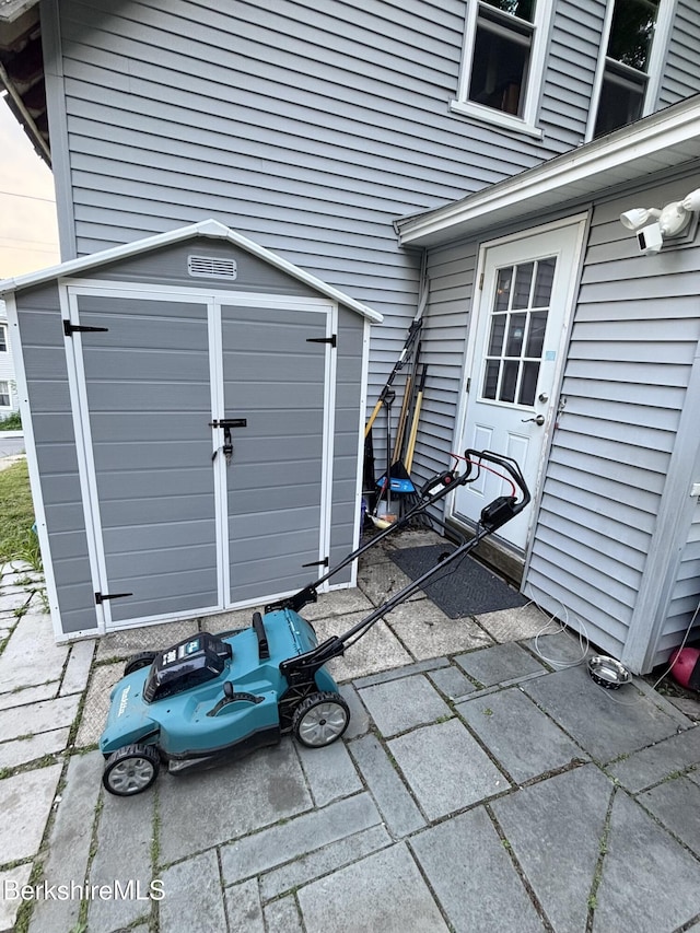 94 Prospect St, North Adams, MA 01247 - view of patio / terrace with a storage shed