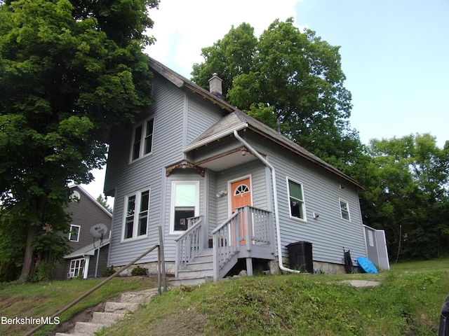94 Prospect St, North Adams, MA 01247 - view of front facade featuring a chimney